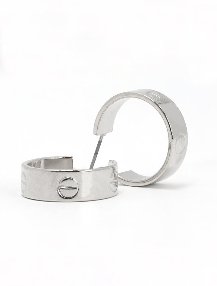 Close-up view of AV Max nailhead hoops in silver.