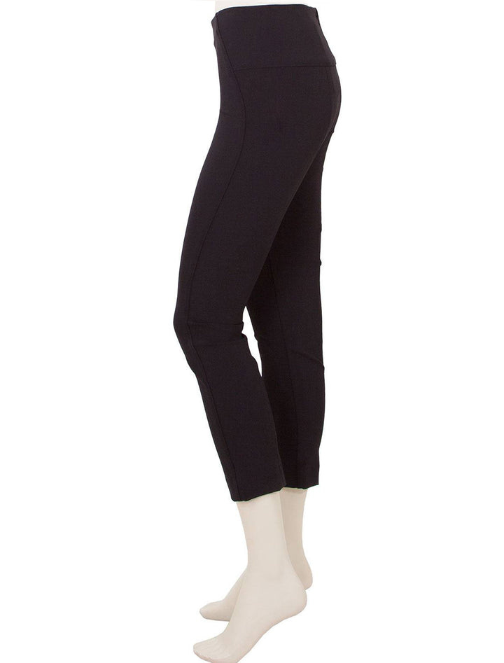 Side view of Veronica Beard's zip back scuba pant in black.