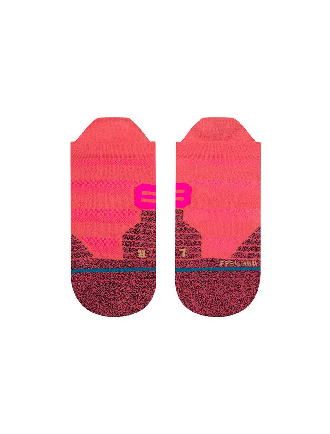 Overhead view of Stance's crossover tab socks in coral.