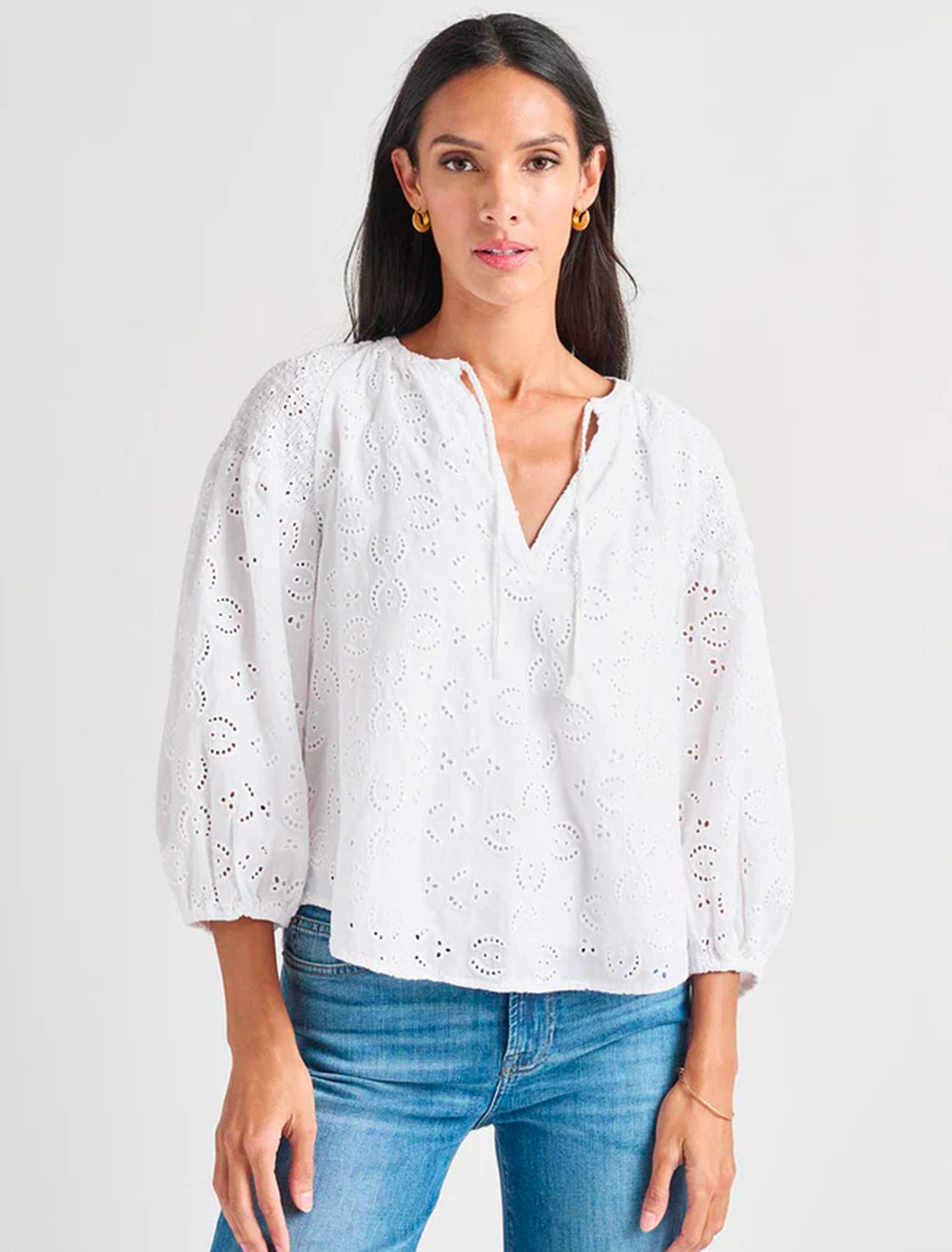 Model wearing Splendid's taylor eyelet top in white.