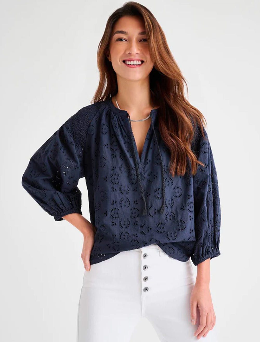 Model wearing Splendid's taylor eyelet top in navy.