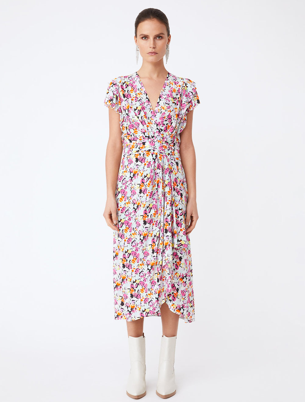 Model wearing Suncoo Paris' callista dress in fuchsia floral.