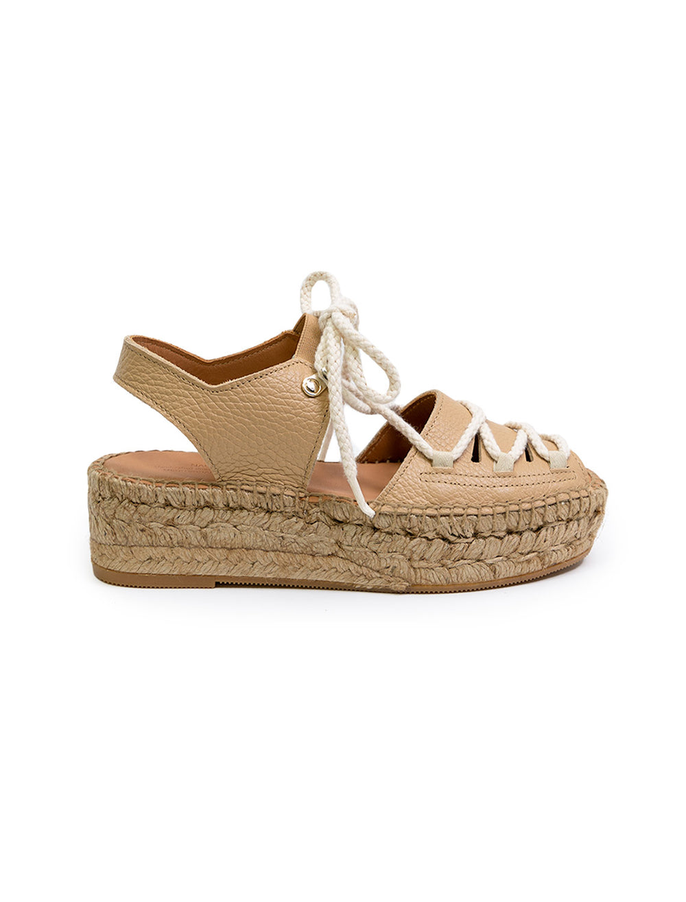 Side view of Naguisa's cima sandal in sand.