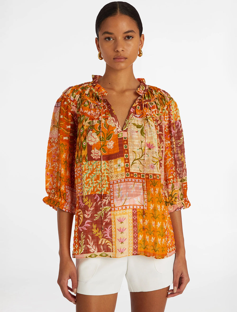 Model wearing Marie Oliver's finley top in poppy patchwork.