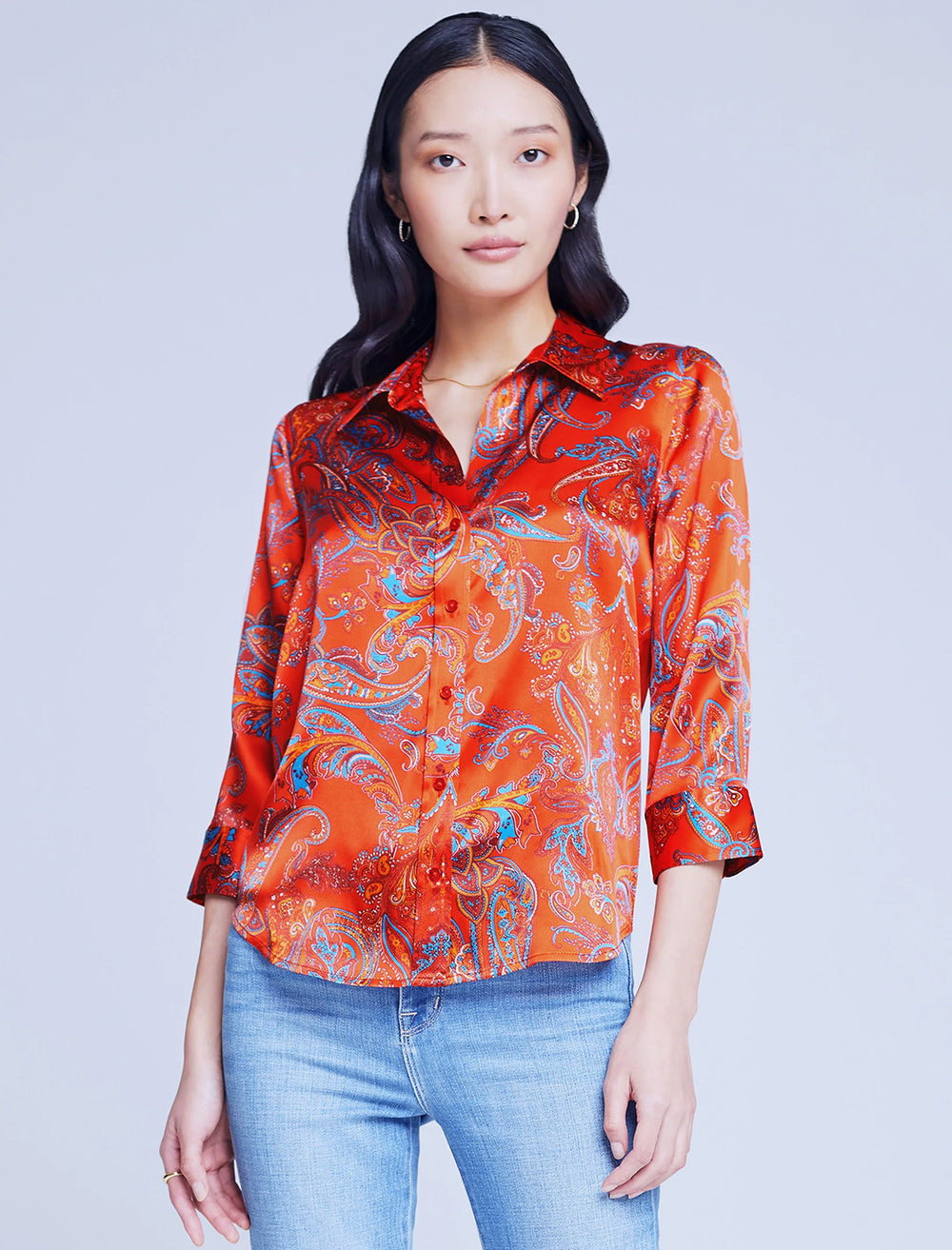 Model wearing L'agence's dani shirt in fire red paisley.