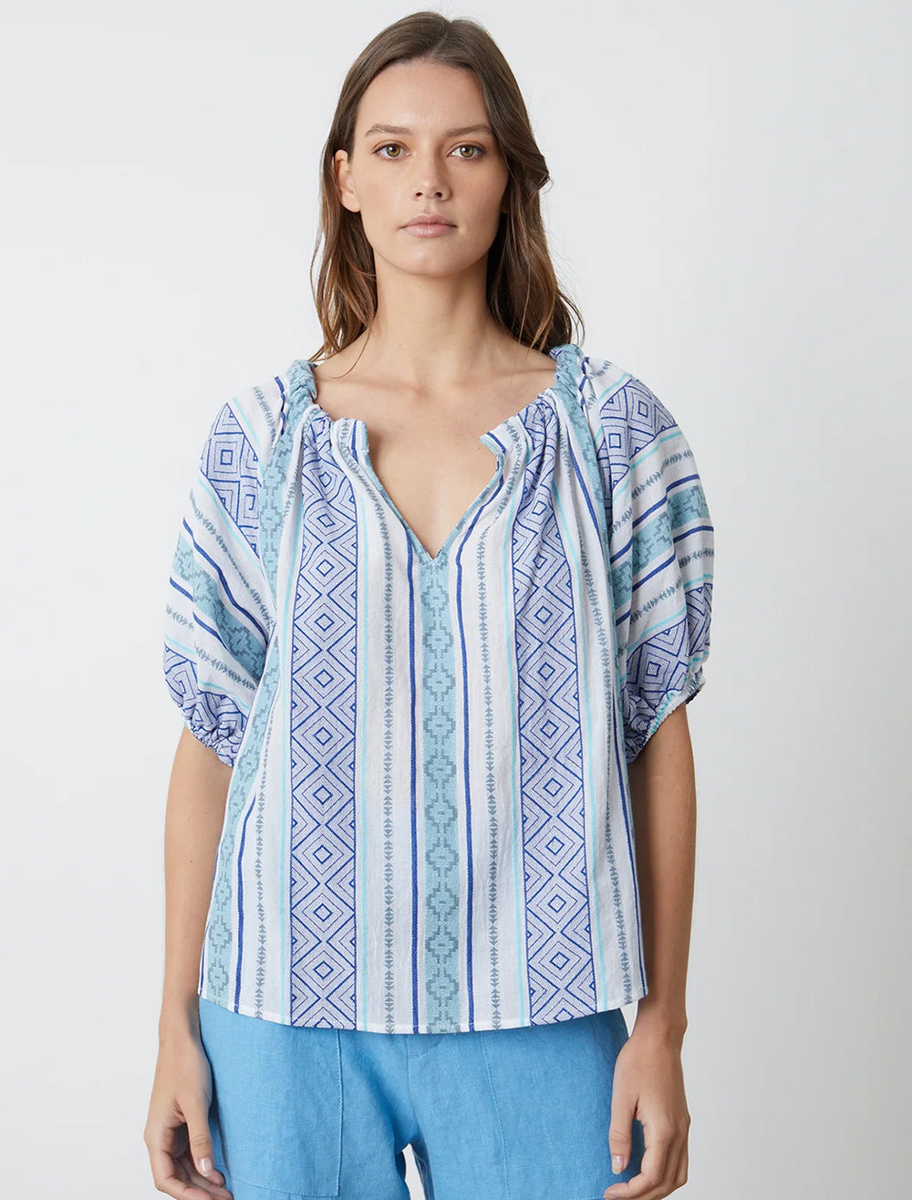 Model wearing Velvet's kimmy top in blue.