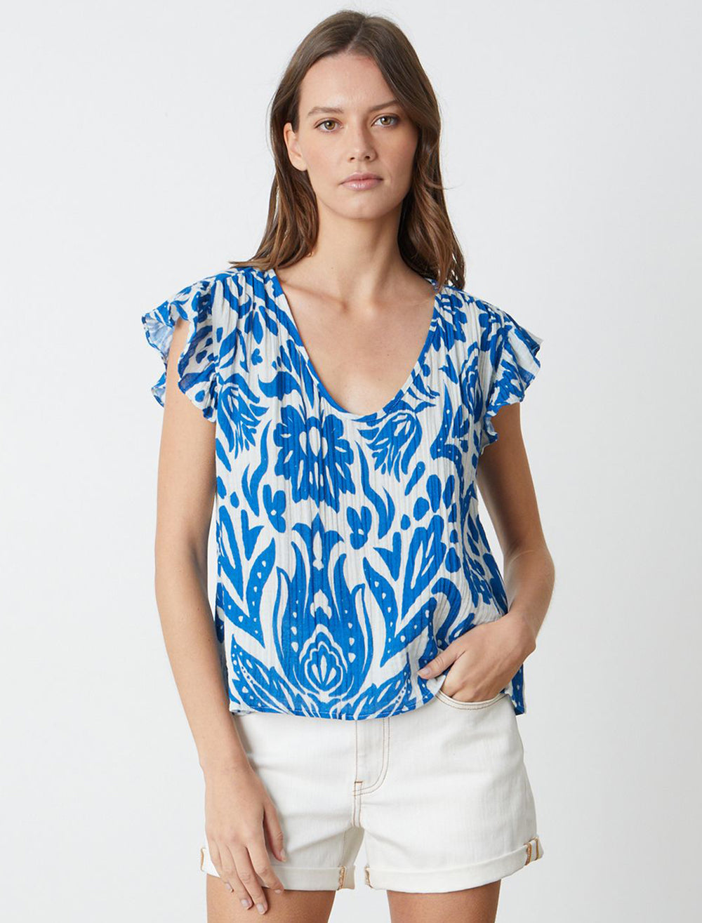 Model wearing Velvet's aleah top in blue.
