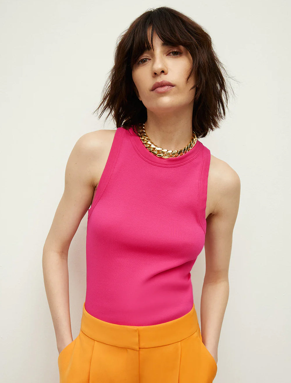 Model wearing Veronica Beard's jordyn tank in fuchsia.