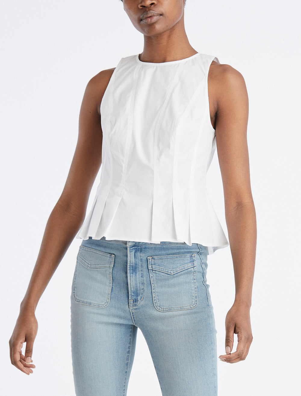 Model wearing Veronica Beard's olympia top in white.