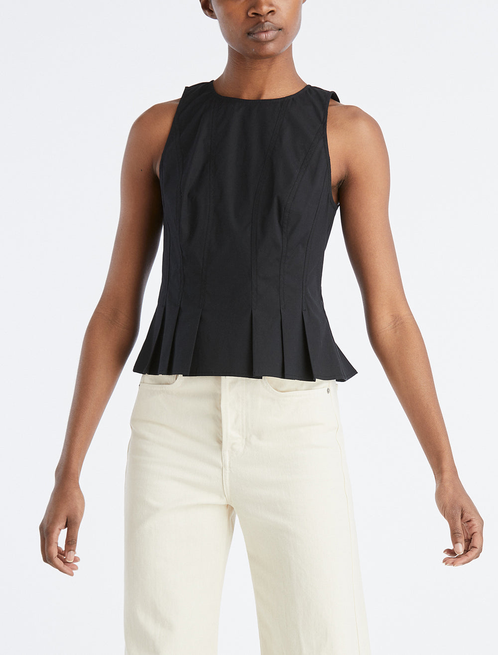 Model wearing Veronica Beard's olympia top in black.