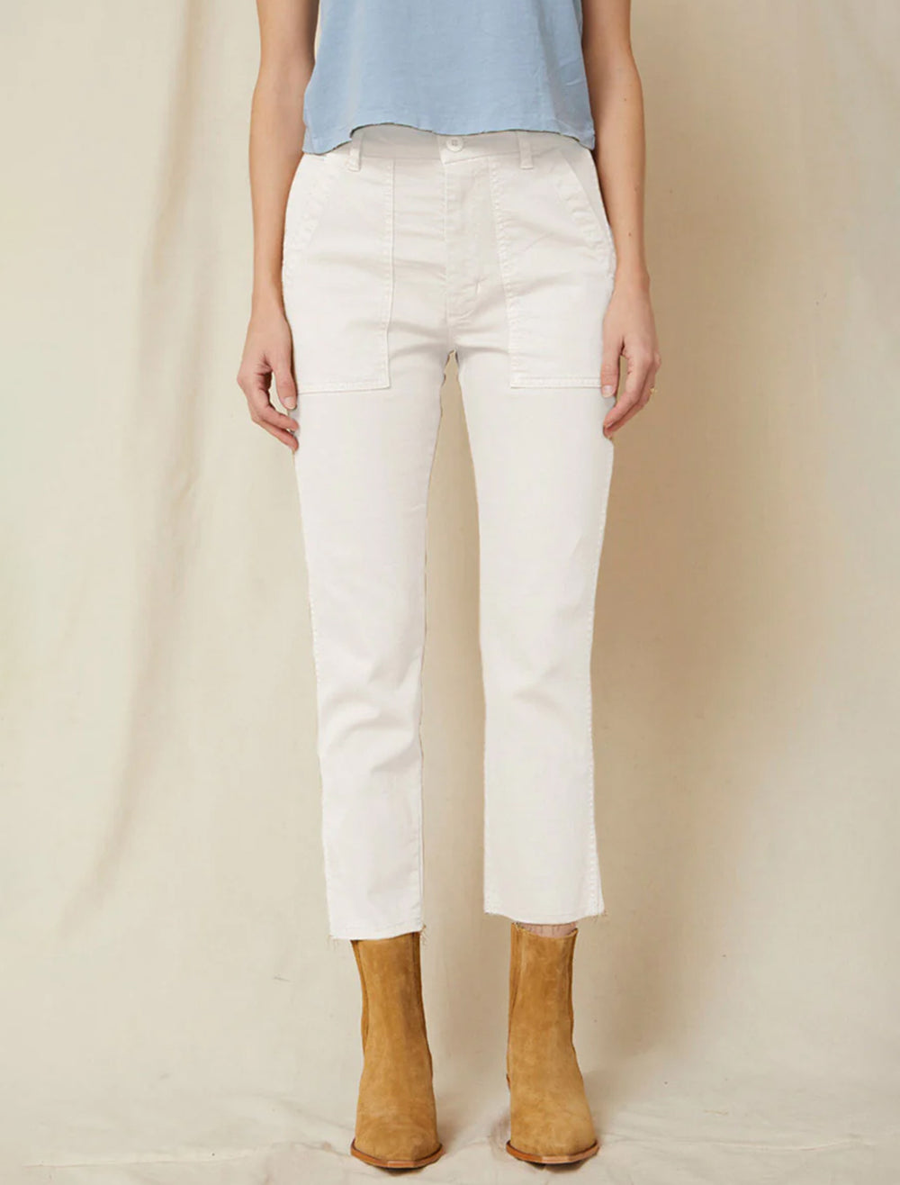 Model wearing AMO's easy army trouser in white oak.