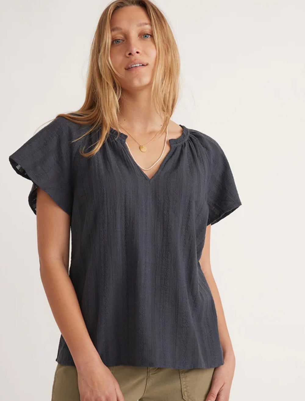 Model wearing Marine Layer's lana textured blouse in india ink.