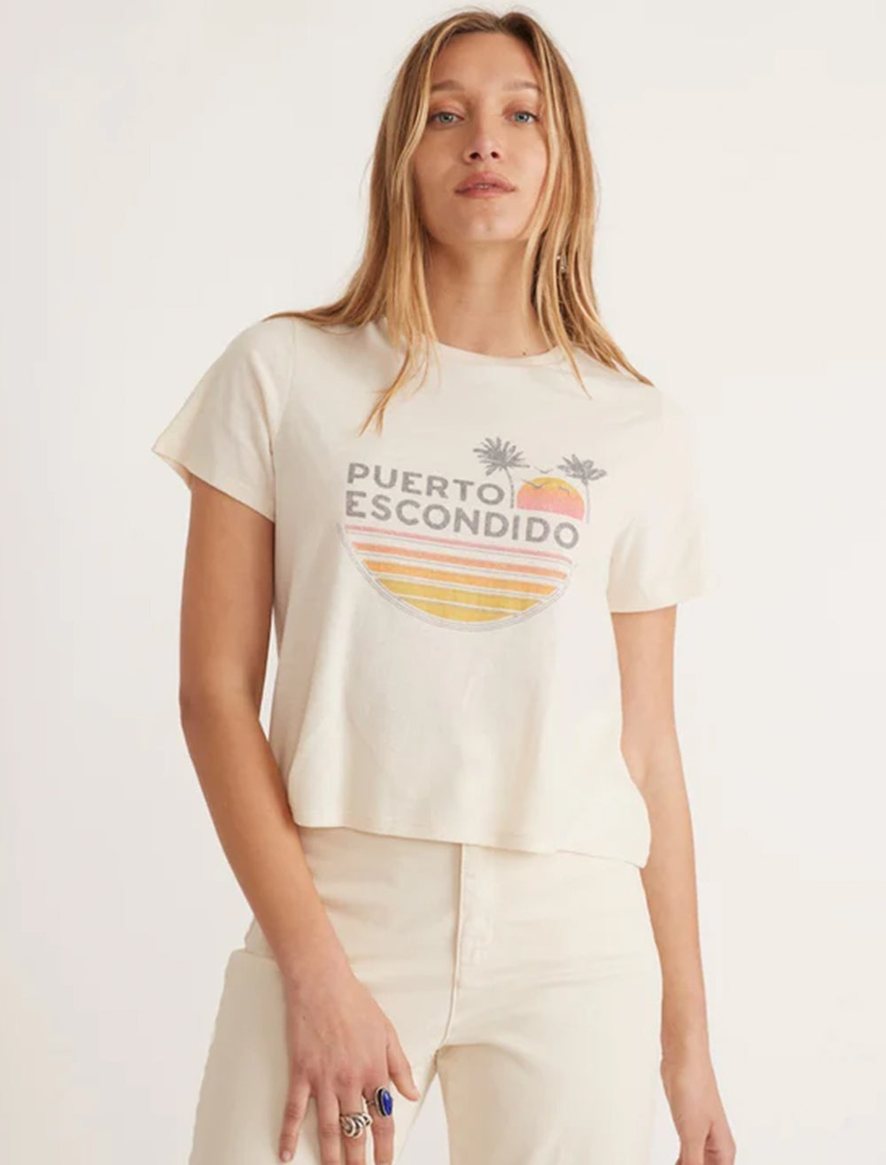 Model wearing Marine Layer's respun crop puerto escondido tee in white.