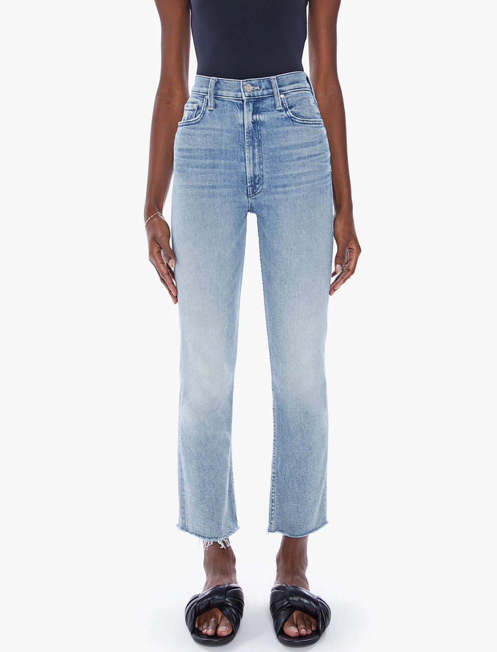 Model wearing Mother Denim's high waisted rider ankle in fish out of water.
