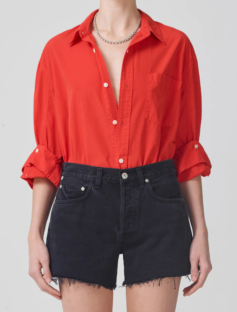 Model wearing Citizens of Humanity's kayla shirt in coral balm.
