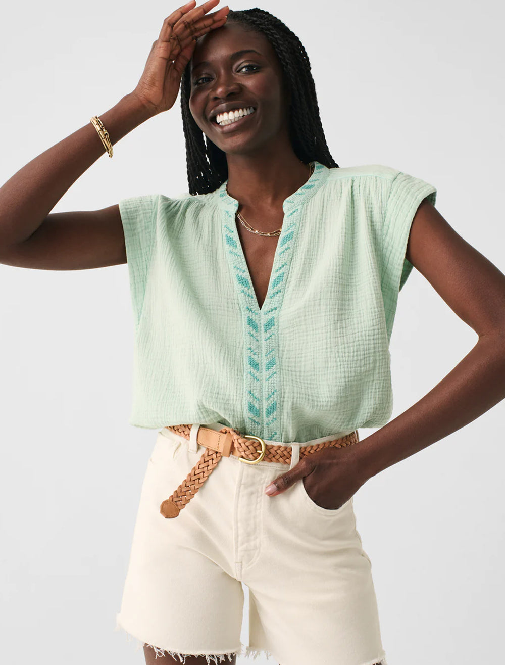 Model wearing Faherty's lucia top in surf spray.