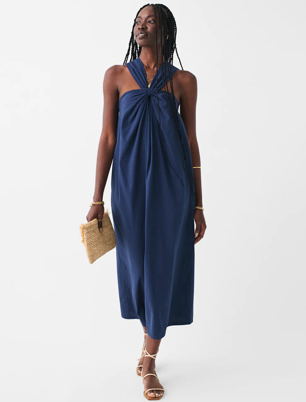 Model wearing Faherty's bay twist seersucker dress in navy.