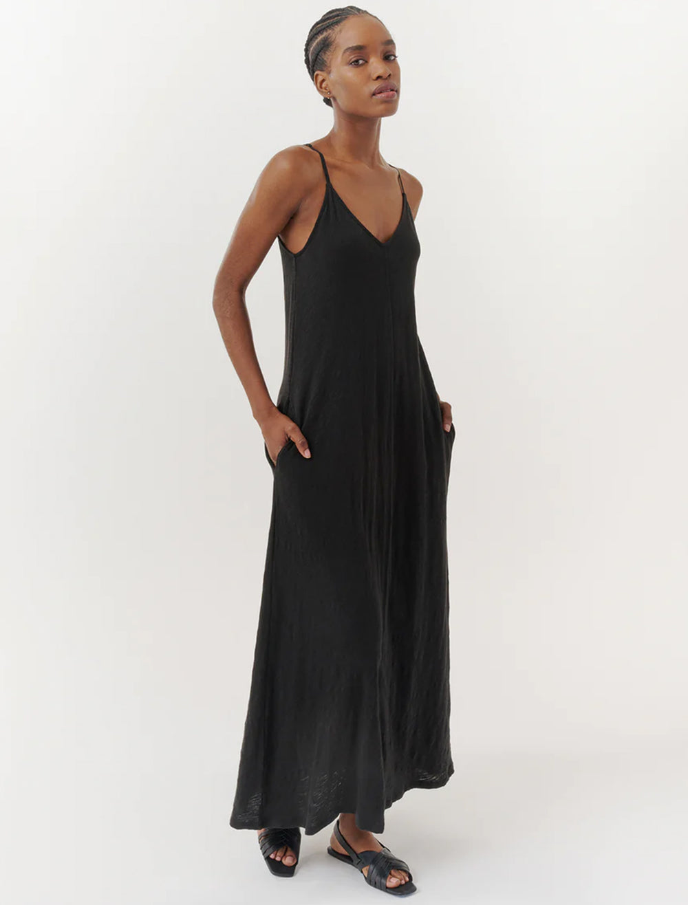 Model wearing ATM's slub jersey tank maxi dress in black.