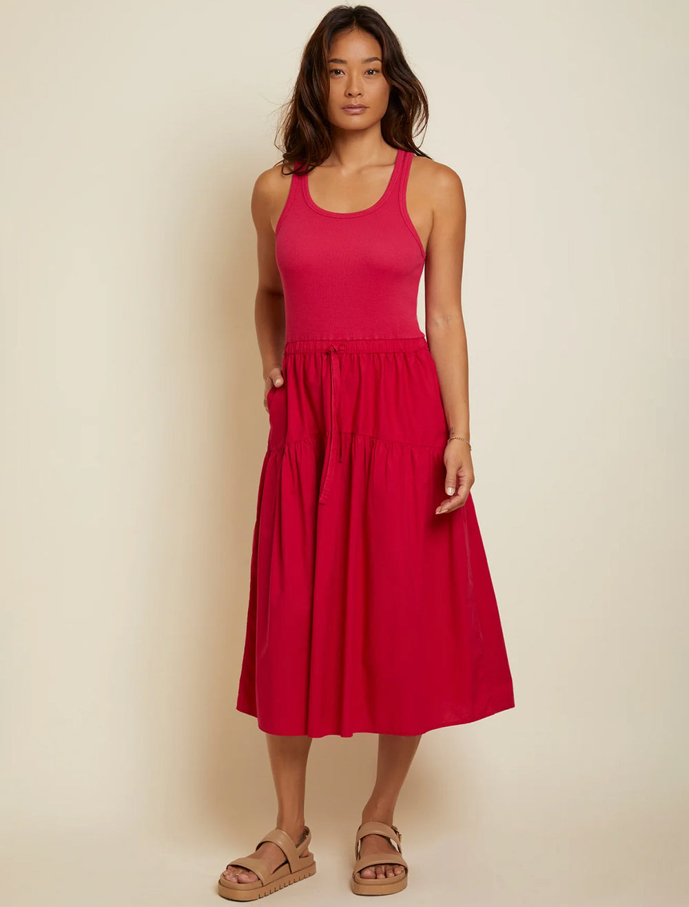 Model wearing Nation LTD.'s frannie combo midi dress in raspberry.