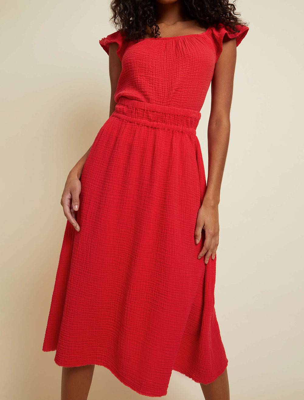 Model wearing Nation LTD's safa skirt in cherry bomb.