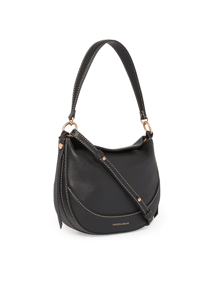 Side angle view of Vanessa Bruno's mini daily bag in noir.
