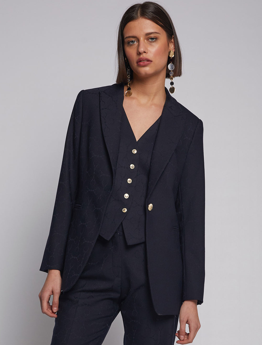Model wearing Vilagallo's sophia horsebit jacquard blazer.