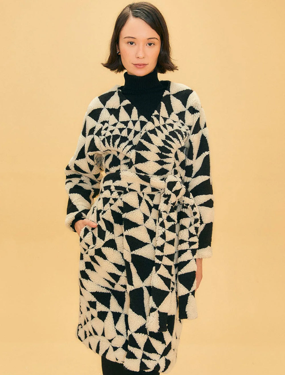 Model wearing Farm Rio's heart deco black and white maxi fleece cardigan.