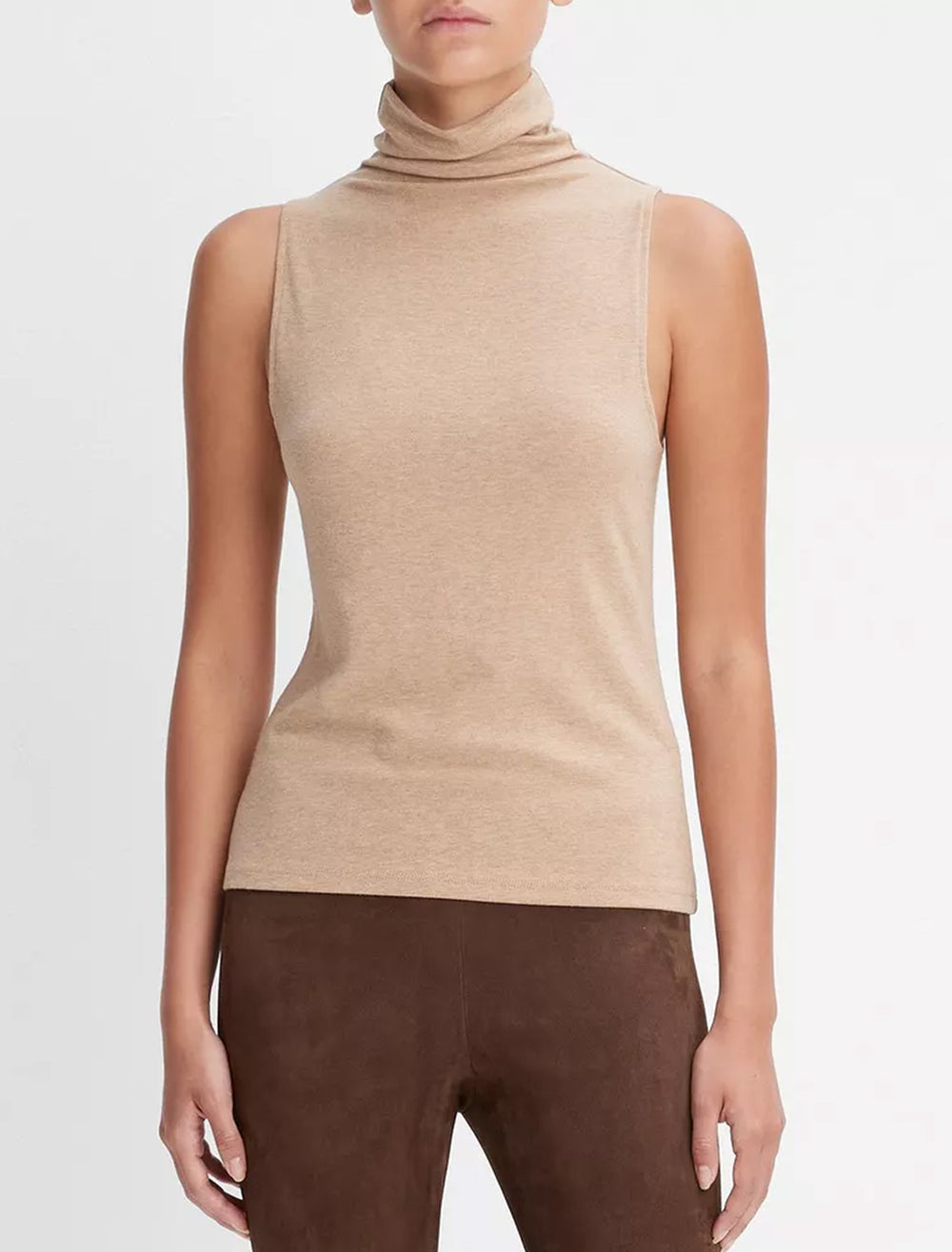 Model wearing Vince's sleeveless turtleneck in cashew.