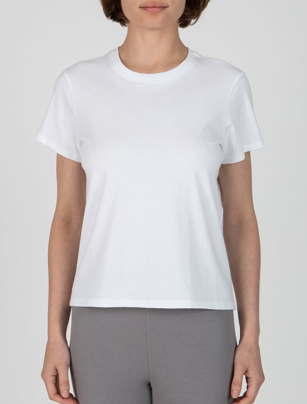 Model wearing ATM's heavyweight jersey crew neck tee in white.