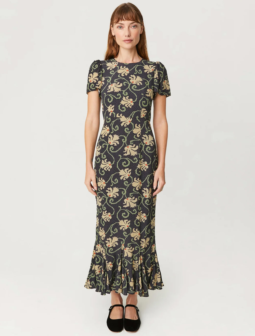 Model wearing Rhode's lulani dress in black mosaic blossom.