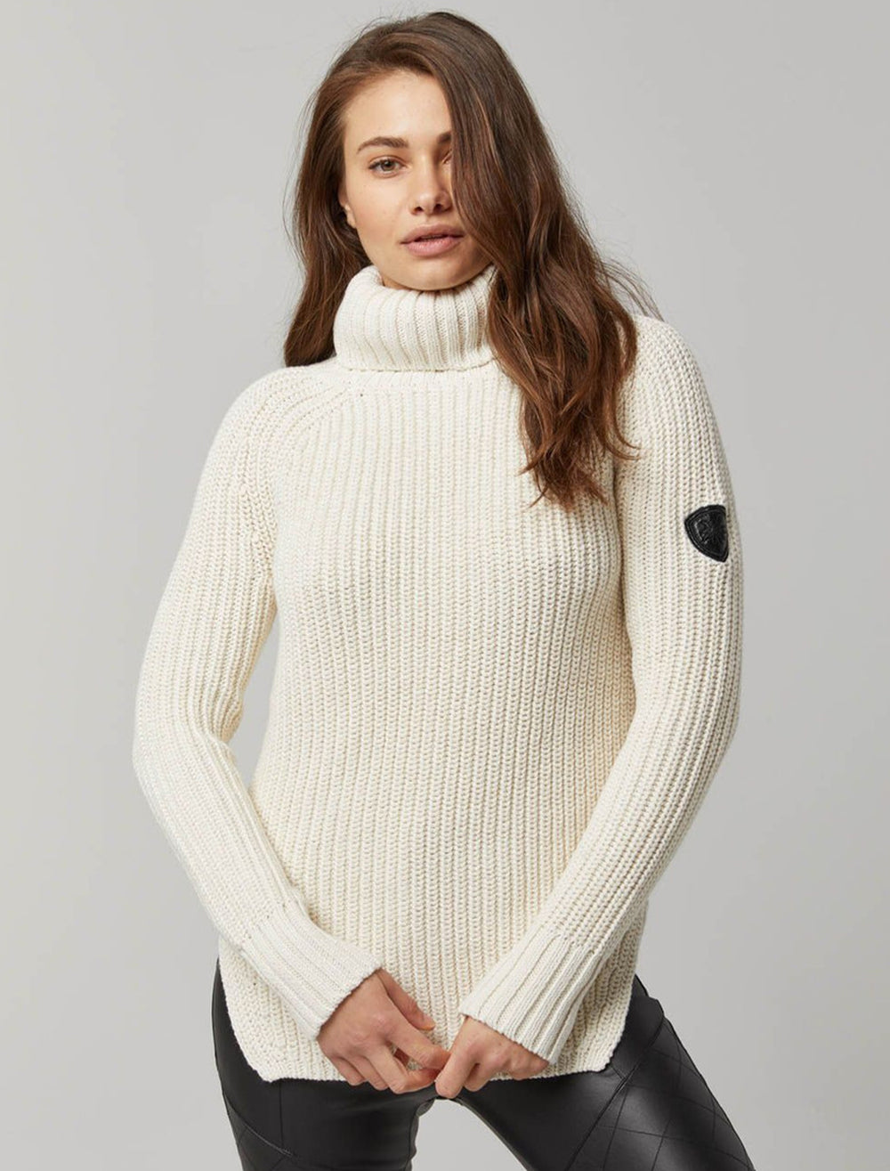 Model wearing Alp N Rock's simone sweater in ivory.