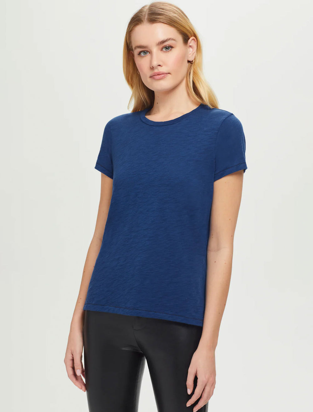 Model wearing Goldie Lewinter's short sleeve contrast stitch boy tee in navy peony/black.