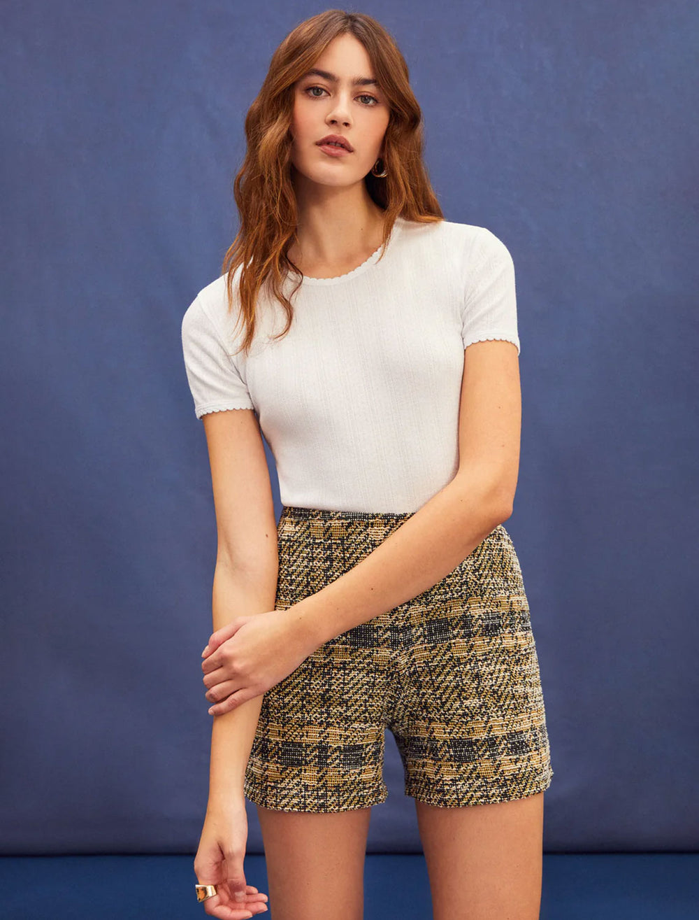Model wearing Goldie Lewinter's short sleeve pointelle tee in white.