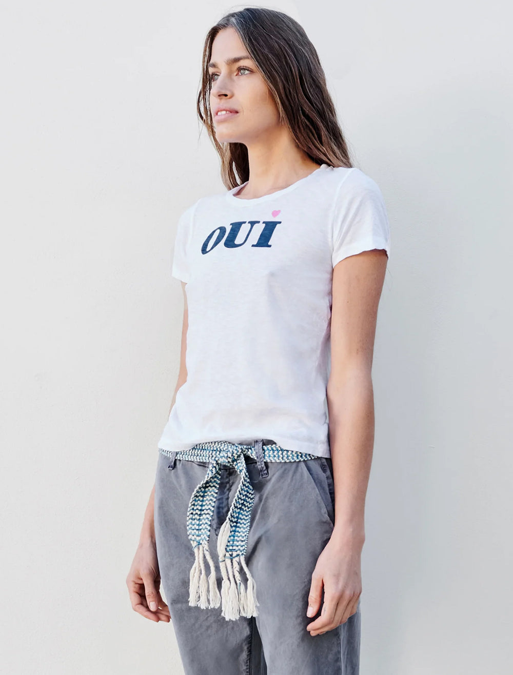 Model wearing Sundry's oui tee in white.