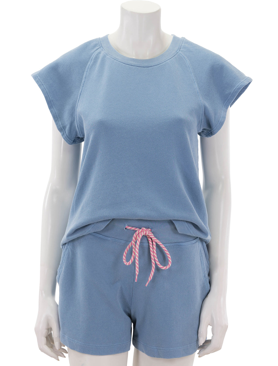 Front view of Sundry's shirttail sweatshirt in pigment capri.