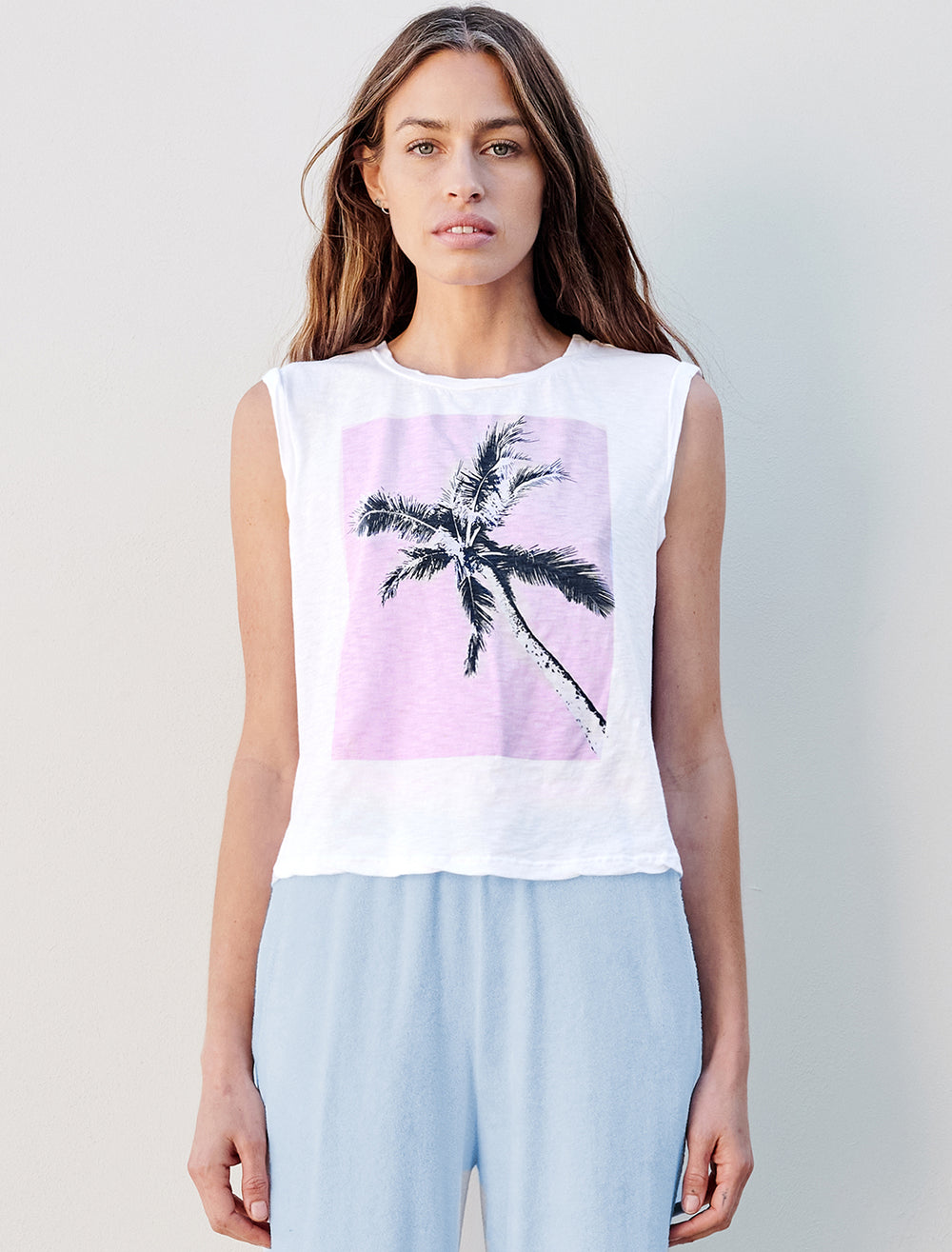 Model wearing Sundry's palm tree muscle tank.