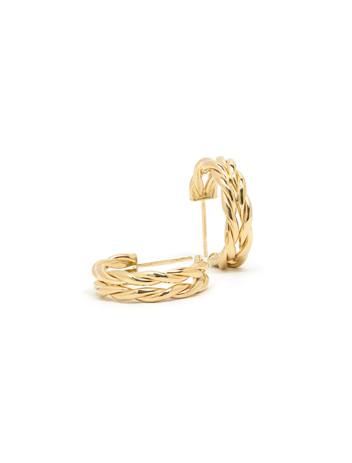 Stylized laydown of Zoe Chicco's 14K Large Braided Hoop Earrings.