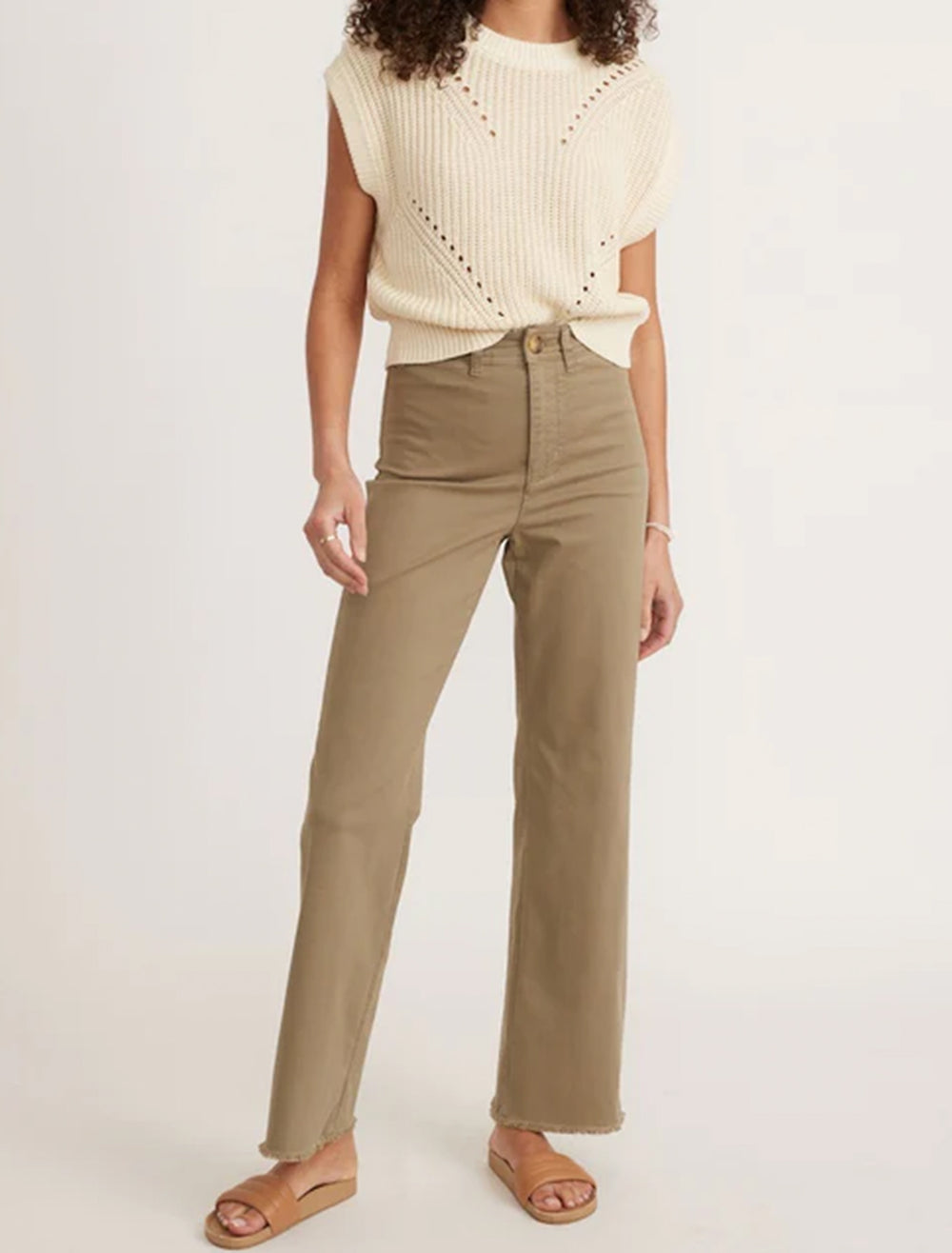 Model wearing Marine Layer's bridget pant in aloe with raw edge.