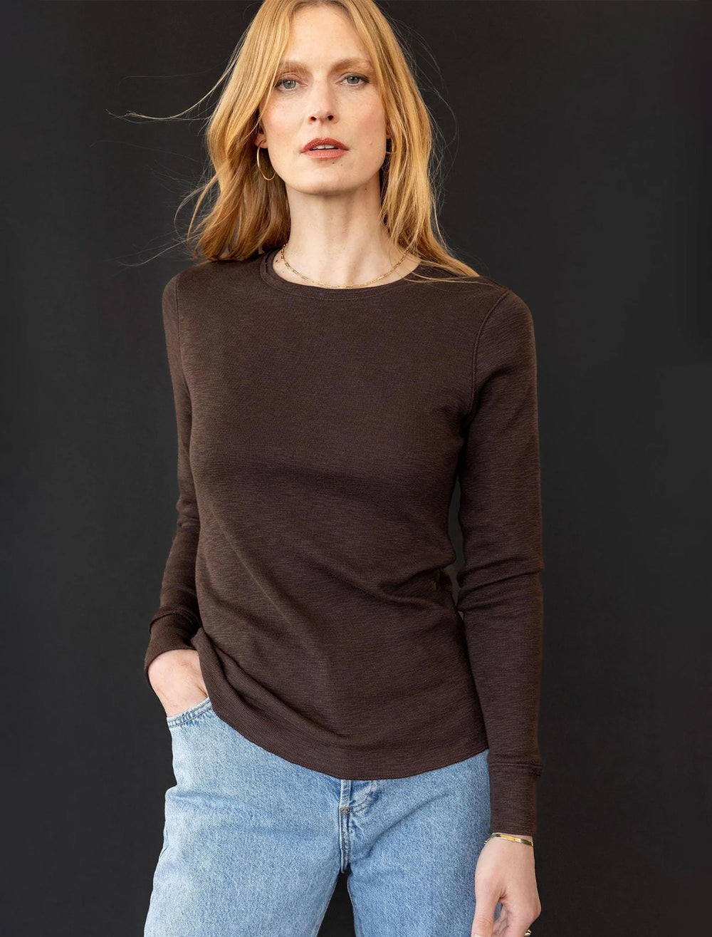 Model wearing Lilla P.'s long sleeve raw edge crew in java.