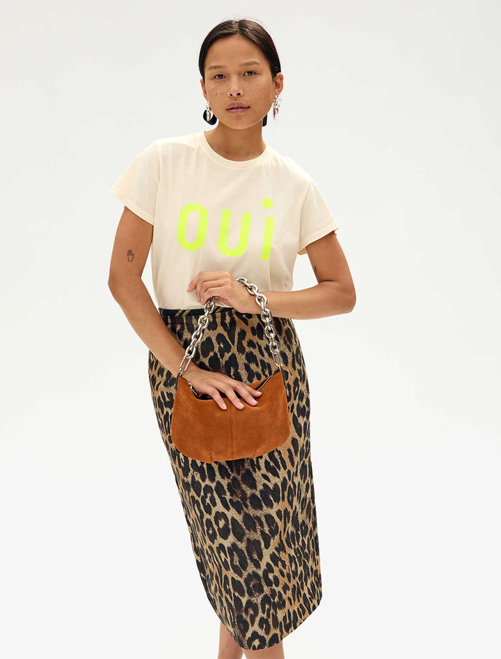Model wearing Clare V.'s shortie strap in silver attached to a handbag.