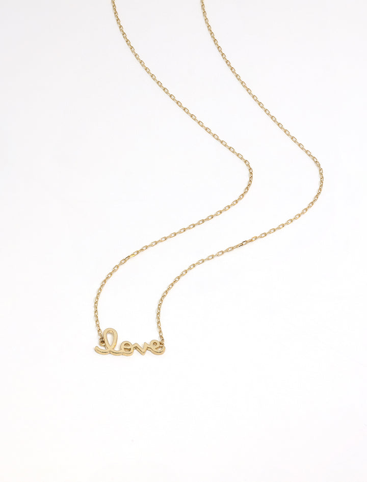Stylized laydown of Sydney Evan's tiny pure love script necklace.
