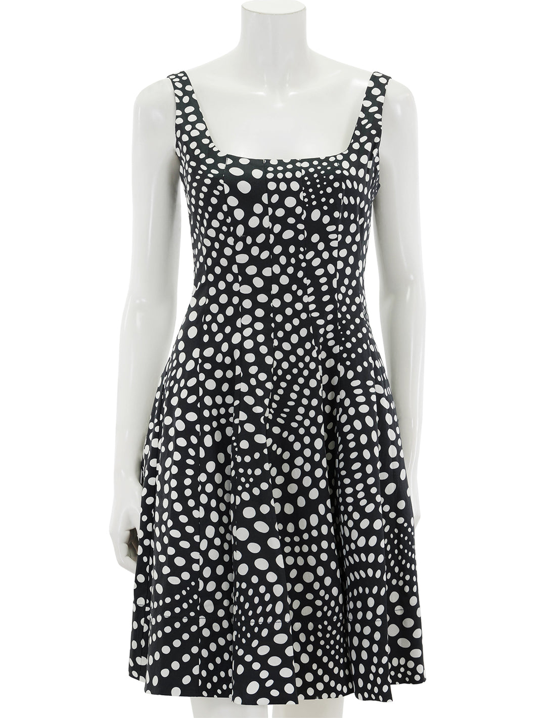 Front view of STAUD's mini wells dress in black wavy dot.