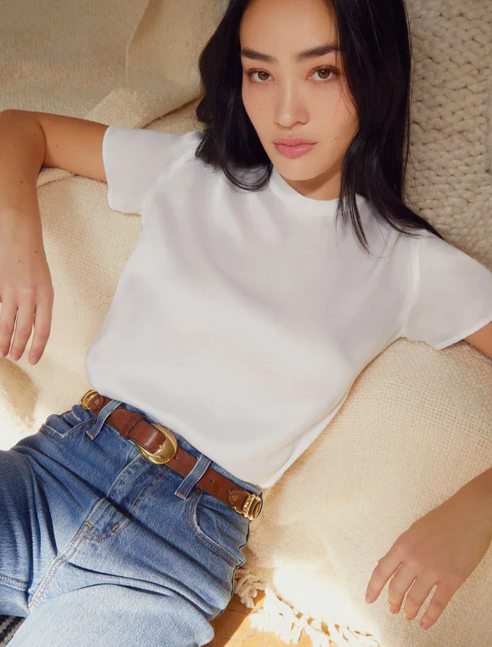 Model wearing Nation LTD's marie top in white sateen.