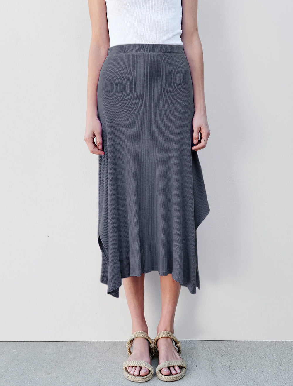 Model wearing Sundry's long relaxed skirt in seep sea.