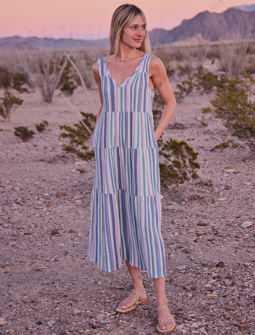 Model wearing Marine Layer's corinne maxi dress in cool stripe.