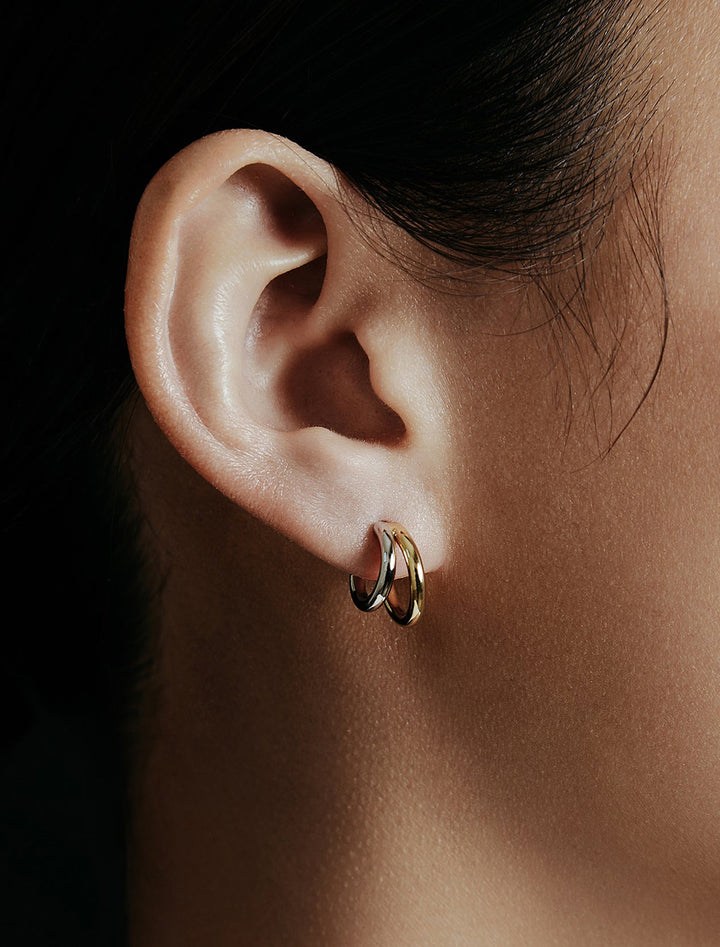 Model wearing Shashi's Gemini Hoops.