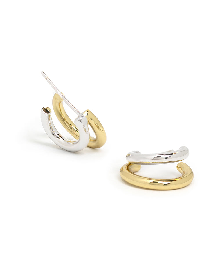 Stylized laydown of Shashi's Gemini Hoops.
