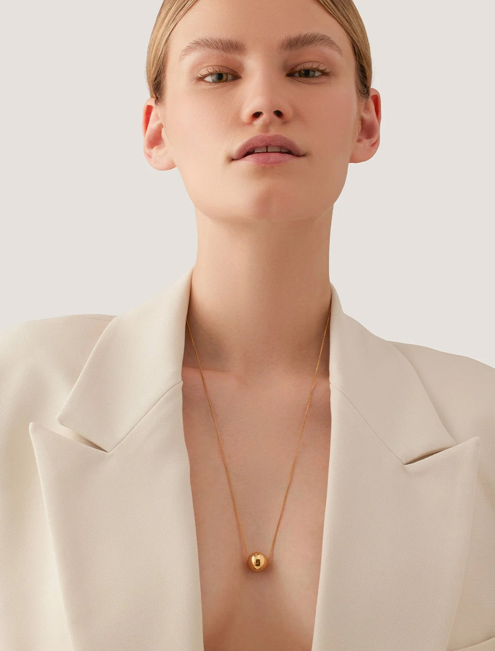 model wearing aurora pendant necklace