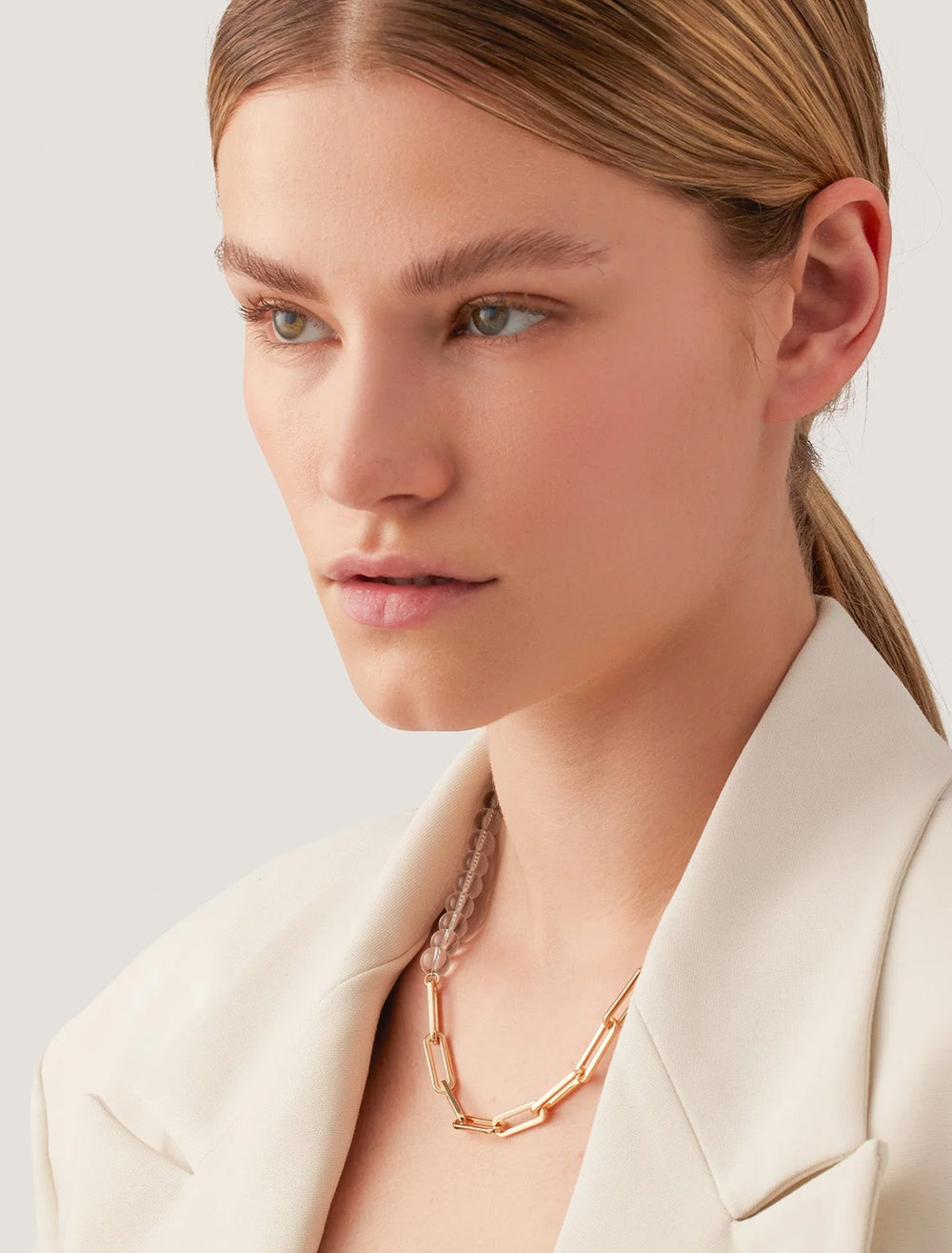 model wearing lyra chain necklace in gold