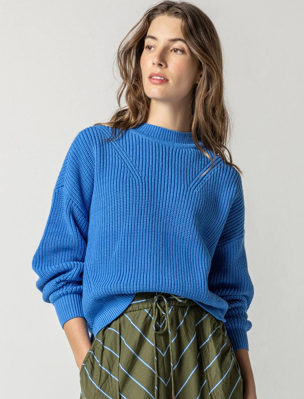 Model wearing Lilla P.'s oversized rib pullover sweater in lapis.